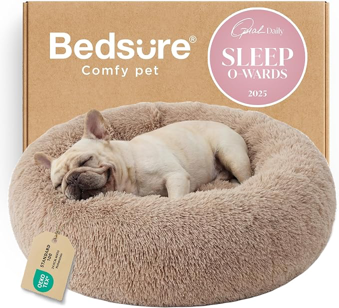 Bedsure calming donut pet bed in camel with a small dog resting inside.