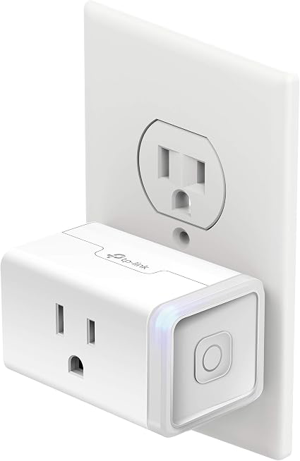 Kasa KP115 smart plug installed in a standard wall outlet.