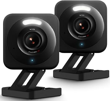 Two black Wyze Cam v4 security cameras on adjustable stands.